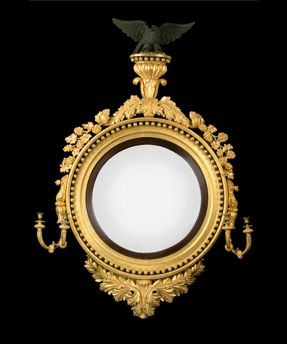 A Regency Period Giltwood Convex Mirror Of Unusually Large Scale